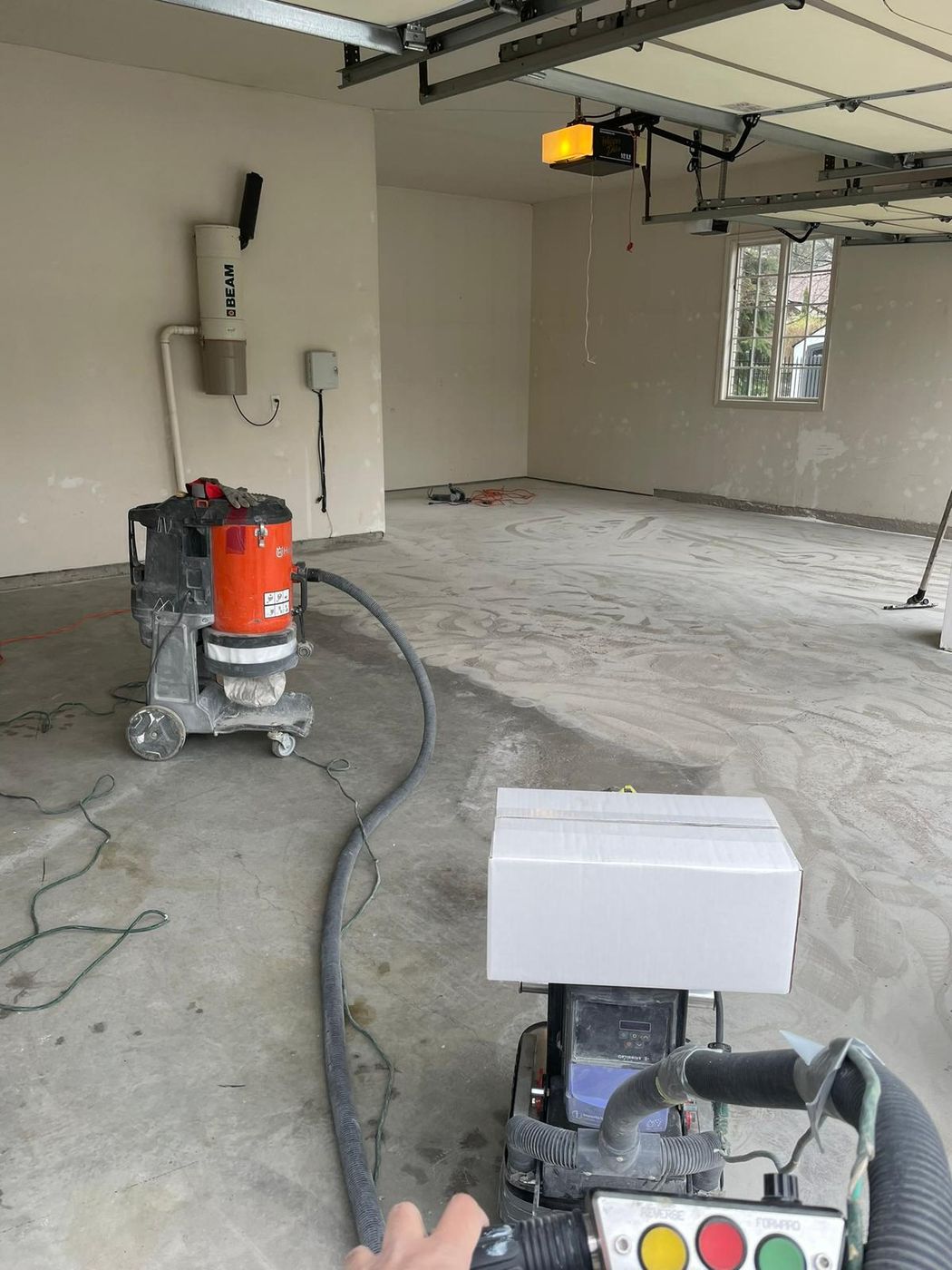 Before - bare concrete garage floor