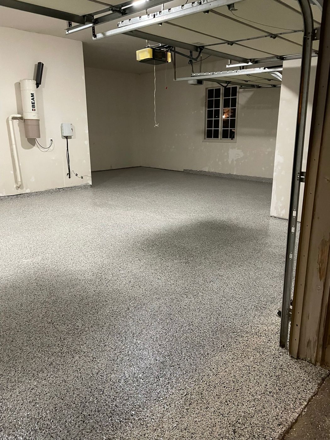 Large garage epoxy floor at night